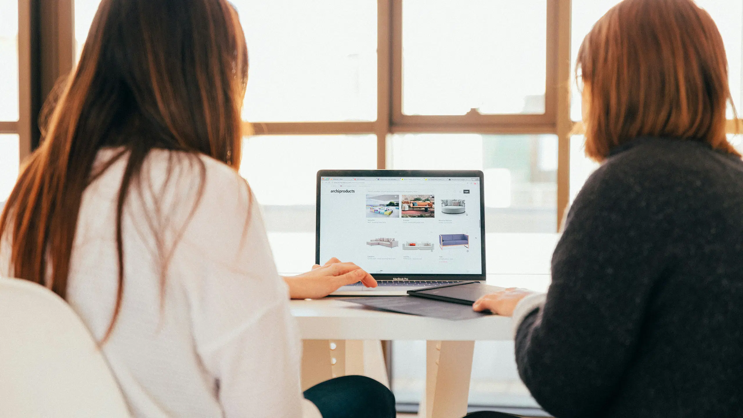 Two women with a laptop